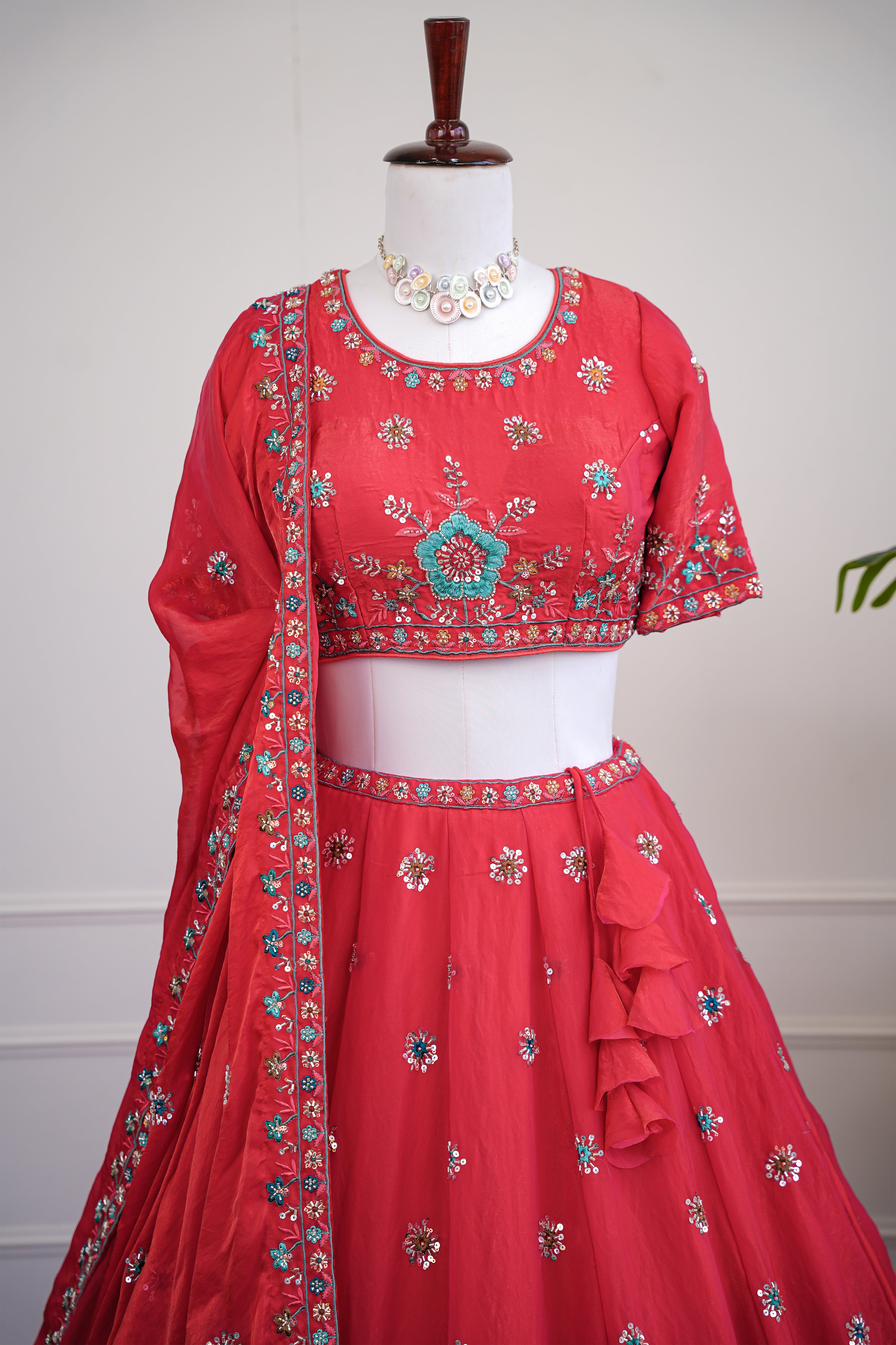 The Coral Red Lehenga with Multicolor Floral Embroidery