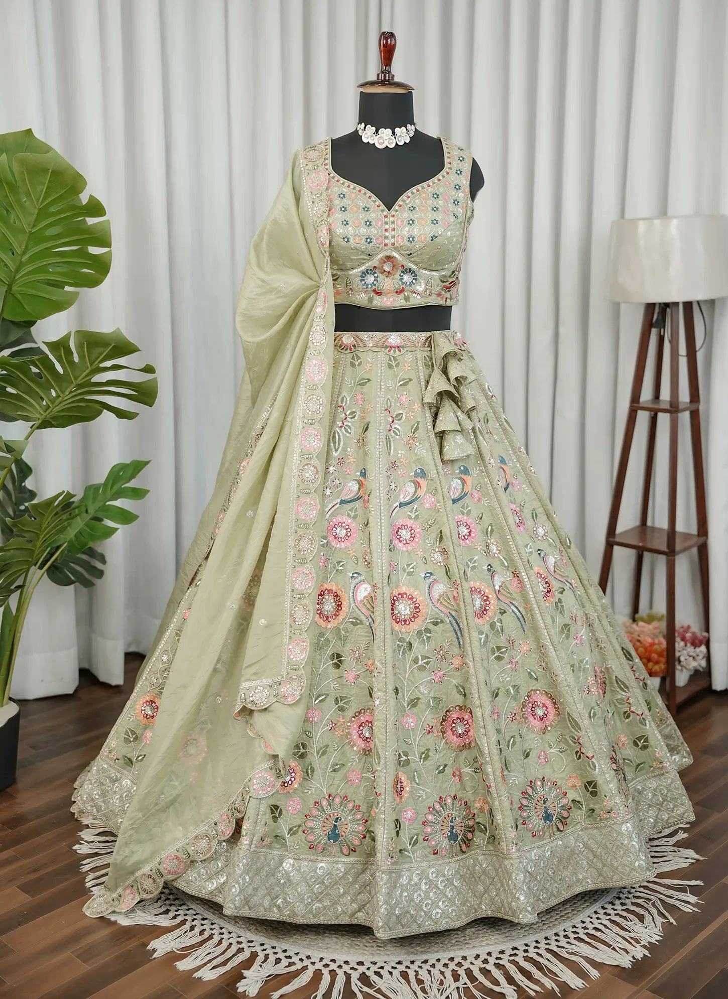 Pastel green floral embroidered lehenga choli set front view with elegant traditional design