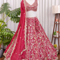 Front view of Rani pink lehenga choli with heavy floral embroidery and detailed traditional design